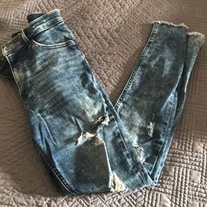 Distressed acid washed frayed hem jeans